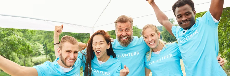 Group of volunteers celebrating boost volunteer engagement