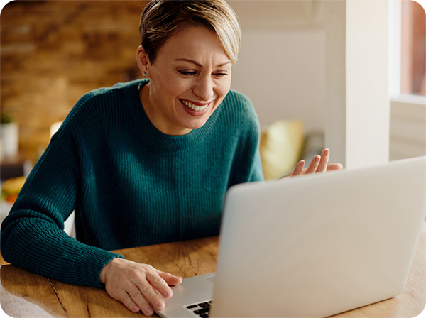 Woman working on computer smiling